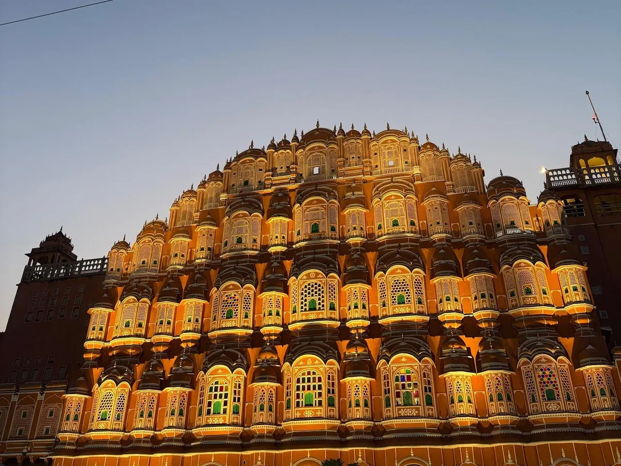 Palace front lit up at dusk
